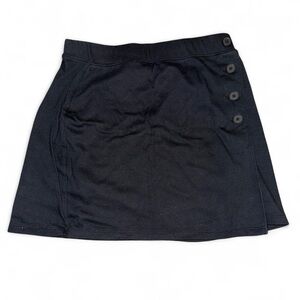 Black SO women’s mini skirt with button detail.
Size S.